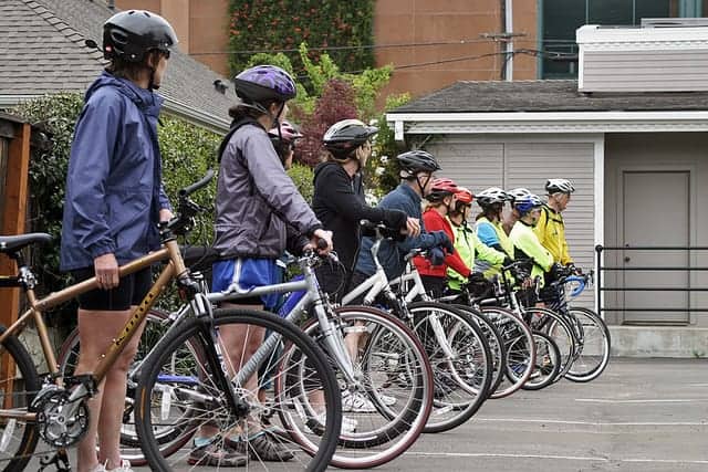 people lined up with bikes