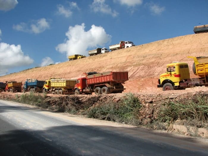 dump trucks on dirt road