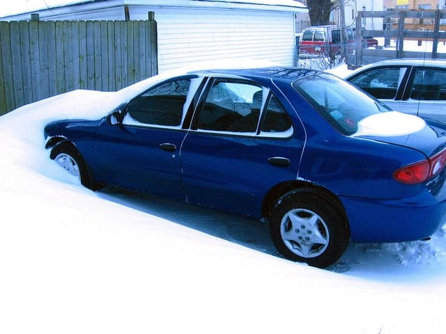 Car under some snow after a blizzard