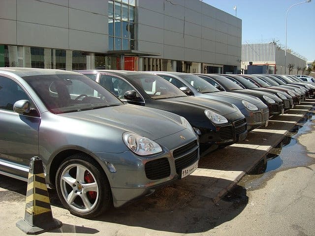 A lineup of Porsche Cayennes.
